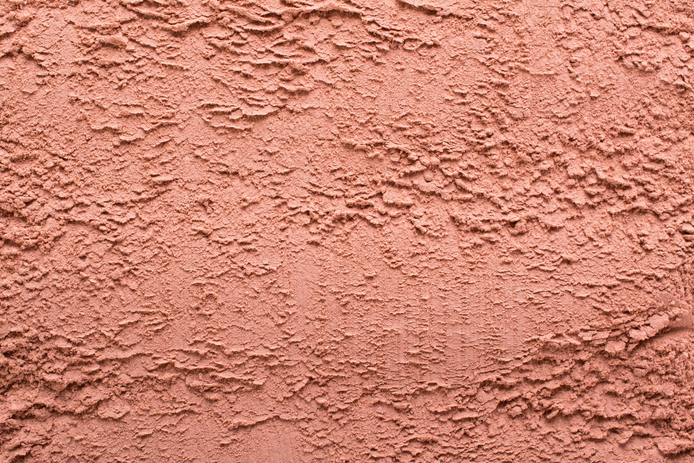 Cosmetic red clay texture, background. Natural mask, dry clay for the face and body.